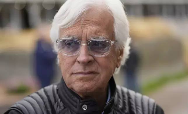 Trainer Bob Baffert watches a horse outside his barn at Churchill Downs Monday, April 28, 2025, in Louisville, Ky. (AP Photo/Charlie Riedel)
