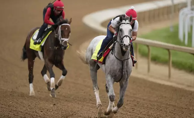 Kentucky Derby entrant Sandman, right, and Grande work out at Churchill Downs Wednesday, April 30, 2025, in Louisville, Ky. (AP Photo/Charlie Riedel)