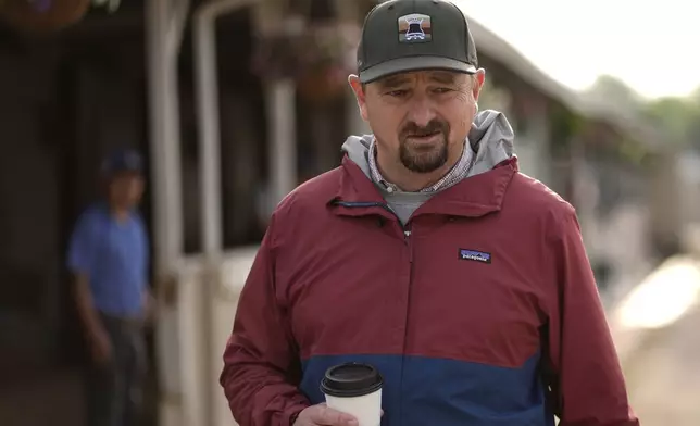 Trainer Michael McCarthy stands outside his barn after a workout by Kentucky Derby entry Journalism at Churchill Downs Tuesday, April 29, 2025, in Louisville, Ky. (AP Photo/Charlie Riedel)