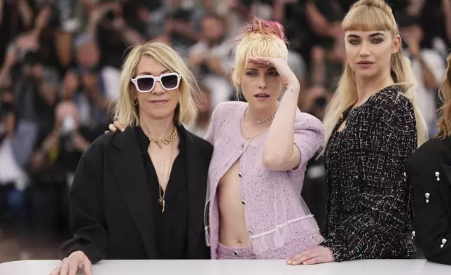 Thora Birch, from left, director Kristen Stewart, and Imogen Poots pose for photographers at the photo call for the film 'The Chronology of Water' at the 78th international film festival, Cannes, southern France, Friday, May 16, 2025. (Photo by Scott A Garfitt/Invision/AP)