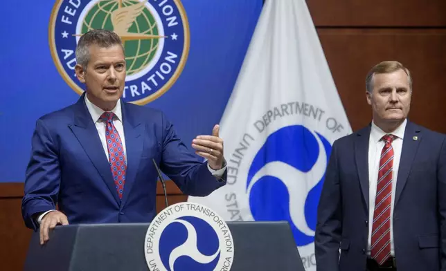 Acting FAA Administrator Chris Rocheleau, right, listens as Secretary of Transportation Sean Duffy speaks during a news conference to provide a status update on Newark Liberty International Airport at the Department of Transportation in Washington, Wednesday, May 28, 2025. (AP Photo/Rod Lamkey, Jr.)