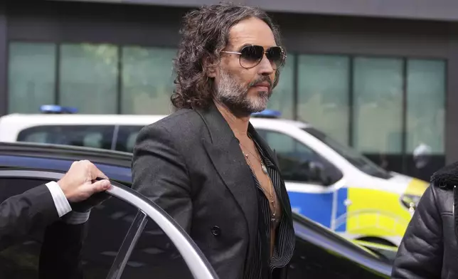 English comedian and actor Russell Brand arrives at Southwark Crown Court where he is charged with rape and sexual assault in London, Friday, May 30, 2025.(AP Photo/Alastair Grant)