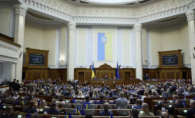 Ukrainian parliamentarians vote for ratification of the Minerals Agreement between Ukraine and United States at Verkhovna Rada in Kyiv, Ukraine, on Thursday, May 8, 2025. (AP Photo/Vadym Sarakhan)