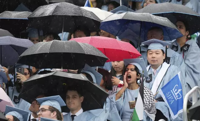 Some students react as Columbia University's acting president Claire Shipman speaks during Columbia University commencement ceremony on Columbia's main campus, in Manhattan, on Wednesday, May 21, 2025 in New York. (AP Photo/Seth Wenig, Pool)