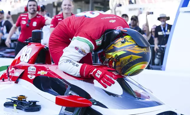 Robert Shwartzman, of Israel, celebrates after winning the pole position during qualifications for the Indianapolis 500 auto race at Indianapolis Motor Speedway in Indianapolis, Sunday, May 18, 2025. (AP Photo/Michael Conroy)