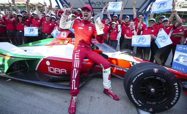 Robert Shwartzman, of Israel, celebrates after winning the pole position during qualifications for the Indianapolis 500 auto race at Indianapolis Motor Speedway in Indianapolis, Sunday, May 18, 2025. (AP Photo/Michael Conroy)