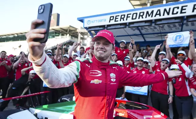 Robert Shwartzman, of Israel, celebrates after winning the pole position during qualifications for the Indianapolis 500 auto race at Indianapolis Motor Speedway in Indianapolis, Sunday, May 18, 2025. (AP Photo/Michael Conroy)