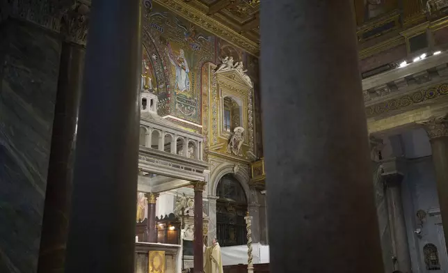 Father Francesco Tedeschi celebrates a mass in Santa Maria in Trastevere church in central Rome, Sunday, May 4, 2025. (AP Photo/Alessandra Tarantino)
