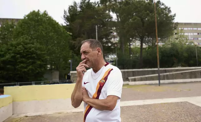 Michele Cufaro, a resident reacts, during an interview with the Associated Press in San Paolo Della Croce parish church in Corviale neighbourhood, in Rome, Sunday, May 4, 2025. (AP Photo/Alessandra Tarantino)