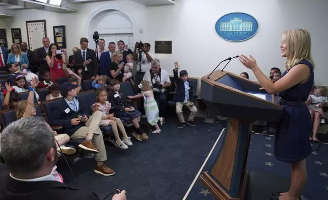 White House press secretary Karoline Leavitt speaks with children during a briefing for children during a Take Our Daughters and Sons to Work Day in the James Brady Press Briefing Room at the White House, Tuesday, May 20, 2025, in Washington. (AP Photo/Evan Vucci)