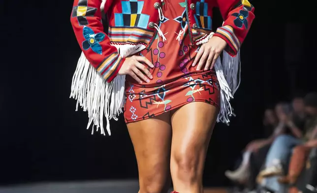 A model wears a design by Livia Manywounds on the runway at the 2025 Native Fashion Show, Friday, May 9, 2025, in Santa Fe, N.M. (AP Photo/Roberto E. Rosales)