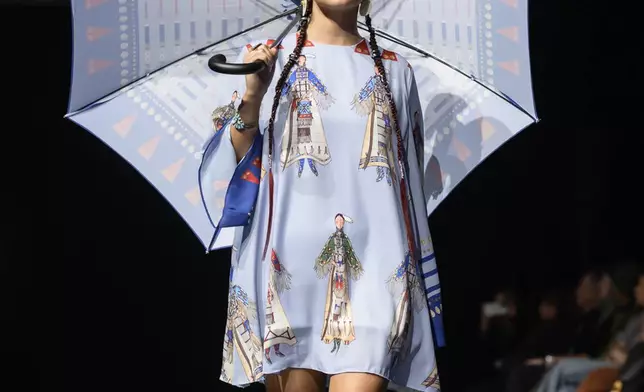 A model wears a design by Lauren Good Day on the runway at the 2025 Native Fashion Show, Friday, May 9, 2025, in Santa Fe, N.M. (AP Photo/Roberto E. Rosales)