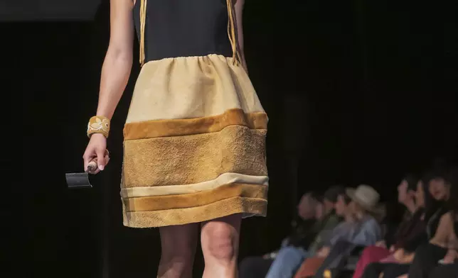 A model wears a design by Randi Nelson on the runway at the 2025 Native Fashion Show, Friday, May 9, 2025, in Santa Fe, N.M. (AP Photo/Roberto E. Rosales)