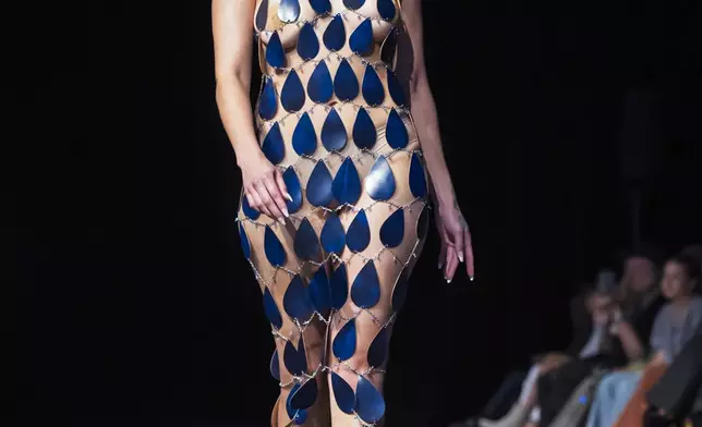 A model wears a design by April Allen on the runway at the 2025 Native Fashion Show, Friday, May 9, 2025, in Santa Fe, N.M. (AP Photo/Roberto E. Rosales)