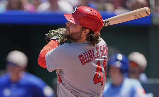 St. Louis Cardinals' Alec Burleson watches his solo home run during the fourth inning of a baseball game against the Kansas City Royals, Sunday, May 18, 2025, in Kansas City, Mo. (AP Photo/Charlie Riedel)