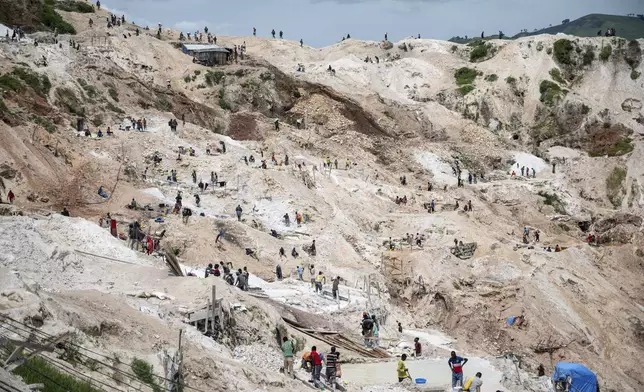 Motorcyclists ride through thick mud on their way to the mining town of Rubaya, Democratic Republic of Congo, on Friday, May 9, 2025. (AP Photo/Moses Sawasawa)