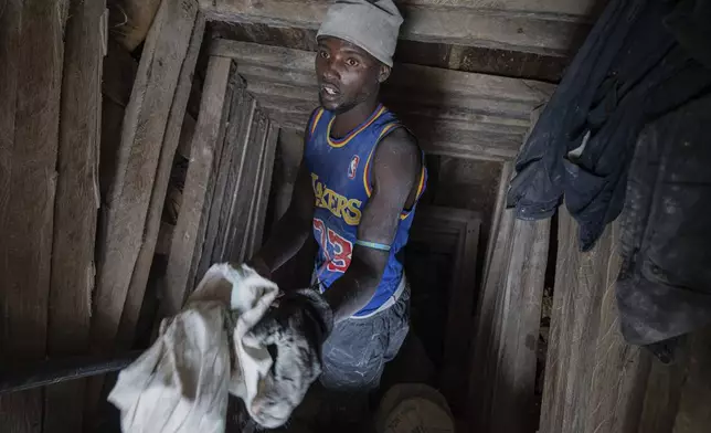 A miner works at the D4 Gakombe coltan quarry in Rubaya, Democratic Republic of Congo, on Friday, May 9, 2025. (AP Photo/Moses Sawasawa)