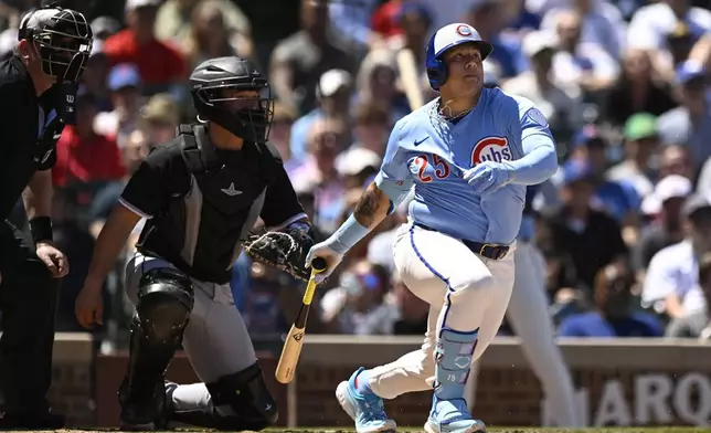 Chicago Cubs' Moises Ballesteros watches his fielder's choice RBI during the second inning of a baseball game against the Chicago White Sox, Friday, May 16, 2025, in Chicago. (AP Photo/Paul Beaty)
