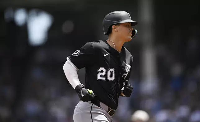 Chicago White Sox's Miguel Vargas rounds third base after hitting a two-run home run during the first inning of a baseball game against the Chicago Cubs, Friday, May 16, 2025, in Chicago. (AP Photo/Paul Beaty)