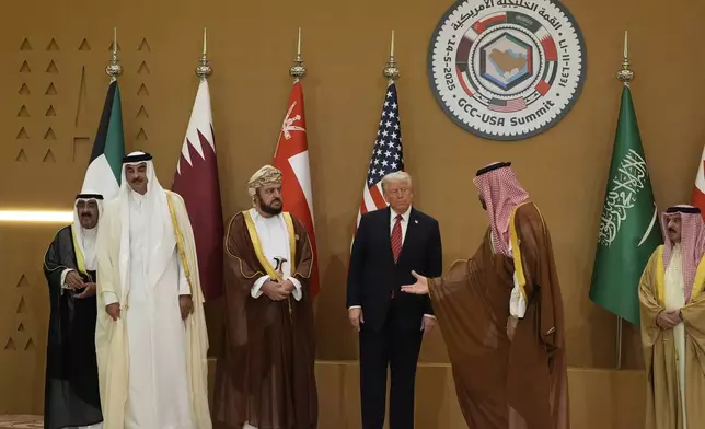 Saudi Crown Prince Mohammed bin Salman, right, welcomes President Donald Trump for the group photo with Gulf Cooperation Council leaders during the GCC Summit in Riyadh, Saudi Arabia, Wednesday, May 14, 2025. (AP Photo/Alex Brandon)