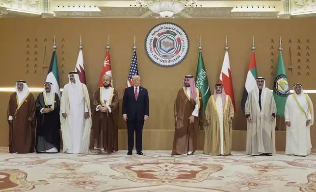 President Donald Trump, fifth left, attends a group photo session with Saudi Crown Prince Mohammed bin Salman, fourth right, with United Arab Emirates Crown Prince Sheikh Khaled bin Mohamed bin Zayed Al Nahyan, second right, Bahrain's Crown Prince and Prime Minister Salman bin Hamad Al Khalifa, left, Qatar's Emir Sheikh Tamim bin Hamad Al Thani, third left, Kuwait's Crown Prince Mishal Al-Ahmad Al-Jaber Al-Sabah, second left, Gulf Cooperation Council Secretary-General Jasem Mohamed Albudaiwi, right, during the GCC Summit in Riyadh, Saudi Arabia, Wednesday, May 14, 2025. (AP Photo/Alex Brandon)
