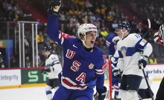 The United States' Zeev Buium celebrates after scoring against Finland during the second period of a quarterfinal match at the ice hockey world championships in Stockholm, Sweden, Thursday, May 22, 2025. (AP Photo/Petr David Josek)
