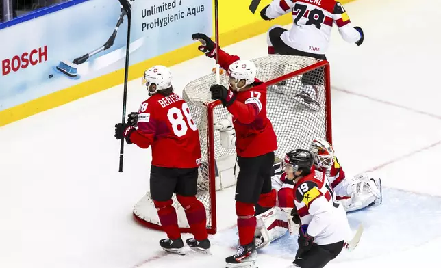 Switzerland's forward Christoph Bertschy (88) celebrates scoring during the ice hockey World Championship quarter final game between Switzerland and Austria, at the Jyske Bank Boxen, in Herning, Denmark, Thursday, May 22, 2025. (Salvatore Di Nolfi/Keystone via AP)