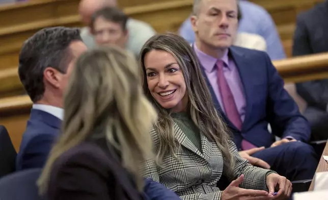 Karen Read smiles as she talks with her attorneys during her trial at Norfolk Superior Court, Tuesday, May 6, 2025, in Dedham, Mass. (Matt Stone/The Boston Herald via AP, Pool)
