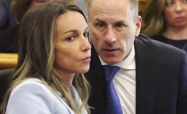Karen Read listens to her defense attorney David Yannetti as her trial in Norfolk Superior Court, Wednesday, May 14, 2025, in Dedham, Mass. (Mark Chavous/Enterprise News via AP, Pool)