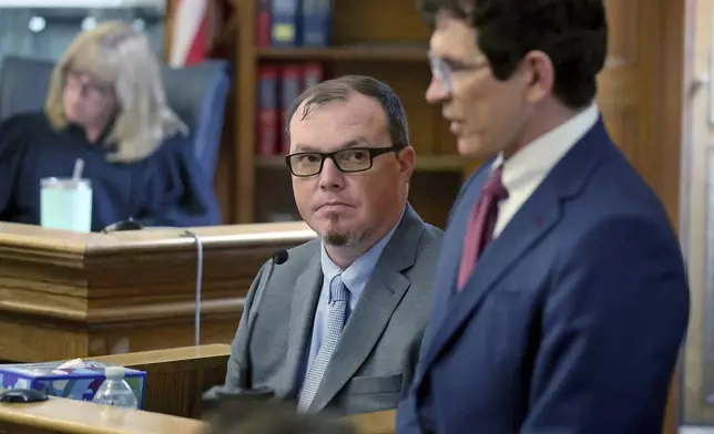 Digital forensics analyst Shanon Burgess looks up at defense attorney Robert Alessi during the Karen Read trial Tuesday, May 20, 2025, in Dedham, Mass. (Matt Stone/The Boston Herald via AP, Pool)