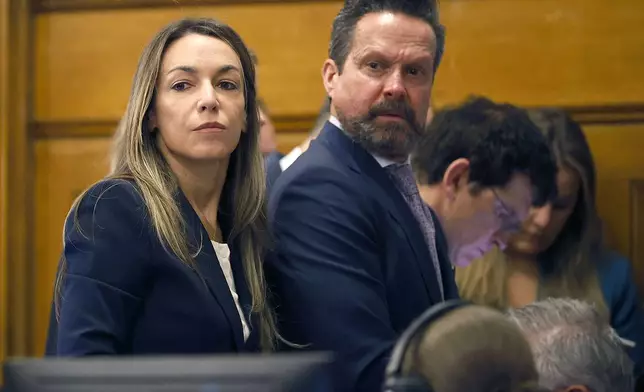 Karen Read and attorney Alan Jackson look at the empty jury box while listening to Judge Cannone during Read's murder trial in Norfolk Superior Court in Dedham, Mass., Wednesday, May 21, 2025. (Greg Derr/The Patriot Ledger via AP, Pool)