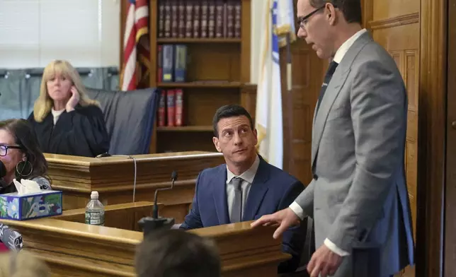 Massachusetts State Trooper, Nicholas Guarino answers questions from prosecutor Hank Brennan about text messages and voice mails on John O'Keefe's cell phone during the Karen Read trial at Norfolk Superior Court, Tuesday, May 6, 2025, in Dedham, Mass. (Matt Stone/The Boston Herald via AP, Pool)