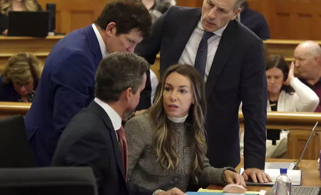 Karen Read talks with her attorneys during her trial at Norfolk Superior Court in Dedham, Mass., Friday, May 2, 2025. (Mark Jarret Chavous/The Enterprise via AP, Pool)