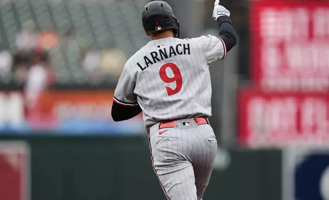 Minnesota Twins' Trevor Larnach (9) rounds the bases after hitting a two-run home run during the second inning in the second baseball game of a doubleheader against the Baltimore Orioles, Wednesday, May 14, 2025, in Baltimore. (AP Photo/Stephanie Scarbrough)