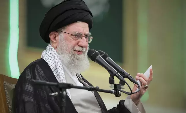 In this photo released by an official website of the office of the Iranian supreme leader, Supreme Leader Ayatollah Ali Khamenei speaks during a meeting with teachers, in Tehran, Iran, Saturday, May 17, 2025. (Office of the Iranian Supreme Leader via AP)