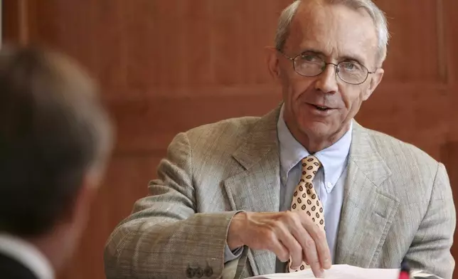 FILE - In this Sept. 16, 2009 file photo, retired Supreme Court Justice David Souter works with his group to promote civics education in New Hampshire schools during a meeting in Concord, N.H. (AP Photo/Jim Cole, FILE)