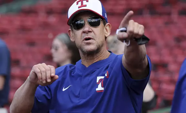 Texas Rangers hitting coach Bret Boone is pictured on the field before a baseball game against the Boston Red Sox on Wednesday, May 7, 2025, in Boston. (AP Photo/Jim Davis)