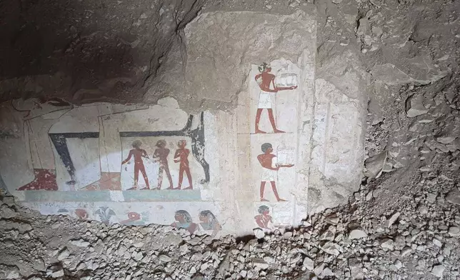 In this undated photo, hieroglyphs are revealed in the three new graves of senior statesmen found in the Dra' Abu al-Naga necropolis area in Luxor, Egypt. (Egypt Ministry of Tourism and Antiquities via AP)