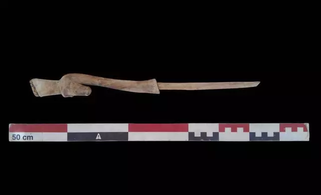 In this undated photo, artifacts are displayed that were found in the three new graves of senior statesmen found in the Dra' Abu al-Naga necropolis area in Luxor, Egypt. (Egypt Ministry of Tourism and Antiquities via AP)