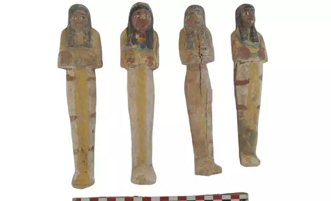 In this undated photo, artifacts are displayed that were found in the three new graves of senior statesmen found in the Dra' Abu al-Naga necropolis area in Luxor, Egypt. (Egypt Ministry of Tourism and Antiquities via AP)