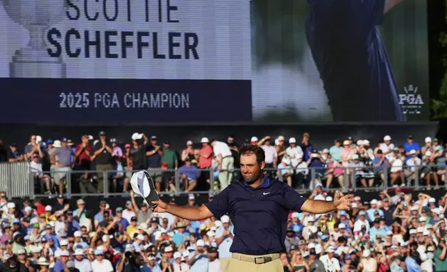 Scottie Scheffler celebrates after winning the PGA Championship golf tournament at the Quail Hollow Club, Sunday, May 18, 2025, in Charlotte, N.C. (AP Photo/Matt York)