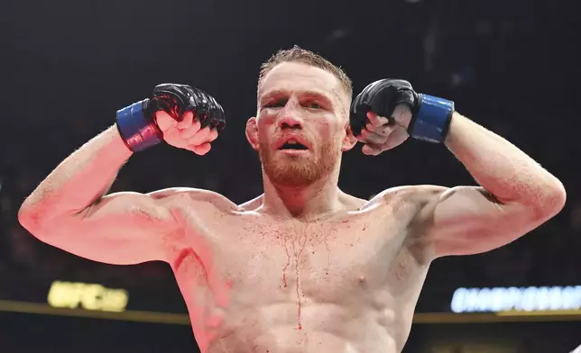 Jack Della Maddalena reacts following his UFC 315 mixed martial arts welterweight title bout against Belal Muhammad in Montreal, Sunday, May 11, 2025. (Graham Hughes/The Canadian Press via AP)
