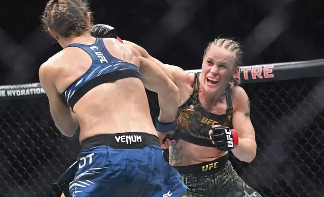 Valentina Shevchenko, right, lands a blow to Manon Fiorot during their UFC 315 mixed martial arts flyweight title bout in Montreal, Saturday, May 10, 2025. (Graham Hughes/The Canadian Press via AP)