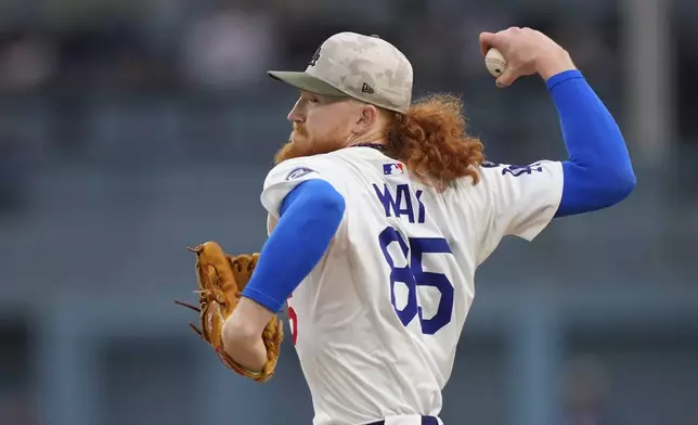 Los Angeles Dodgers starting pitcher Dustin May throws to the plate during the firtst inning of a baseball game against the Los Angeles Angels, Friday, May 16, 2025, in Los Angeles. (AP Photo/Mark J. Terrill)