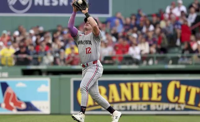 Minnesota Twins outfielder Harrison Bader catches a pop fly for a third out during the third inning of a baseball game against the Boston Red Sox, Sunday, May 4, 2025, in Boston. (AP Photo/Mark Stockwell)