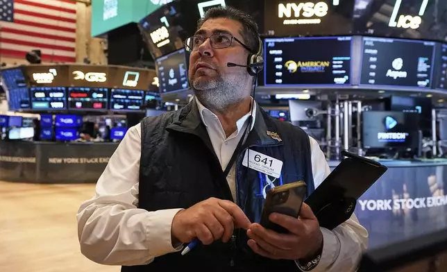 Trader Michael Capolino works on the floor of the New York Stock Exchange, Thursday, May 8, 2025. (AP Photo/Richard Drew)