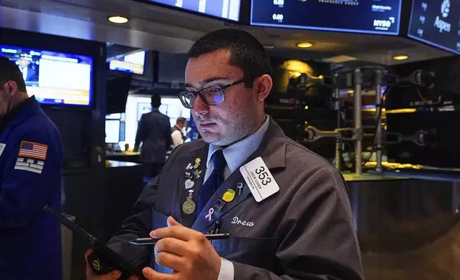 Trader Drew Cohen works on the floor of the New York Stock Exchange, Thursday, May 8, 2025. (AP Photo/Richard Drew)