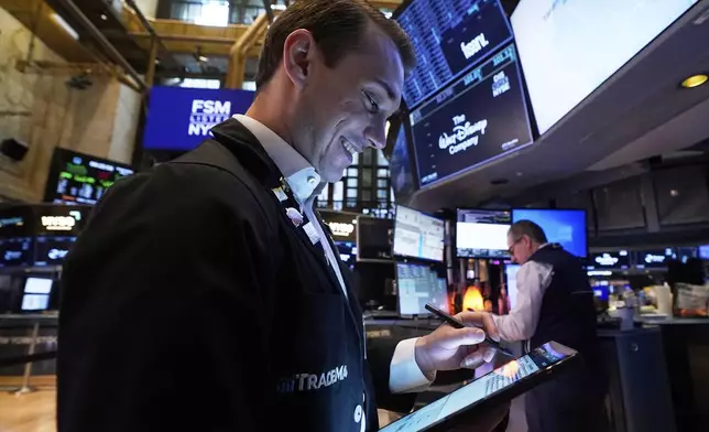 Trader Dylan Halvorsan works on the floor of the New York Stock Exchange, Wednesday, May 7, 2025. (AP Photo/Richard Drew)