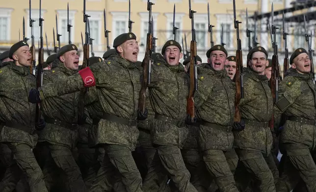 Troops march during a rehearsal for the Victory Day military parade at the Dvortsovaya (Palace) Square in St. Petersburg, Russia, Wednesday, April 30, 2025. (AP Photo/Dmitri Lovetsky)