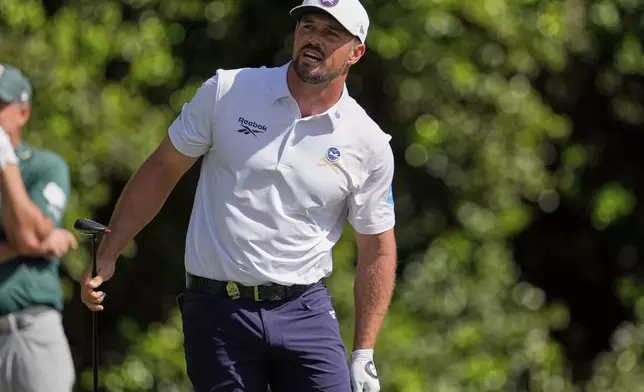 Bryson DeChambeau watches his tee shot on the 14th hole during the third round of the PGA Championship golf tournament at the Quail Hollow Club, Saturday, May 17, 2025, in Charlotte, N.C. (AP Photo/George Walker IV)